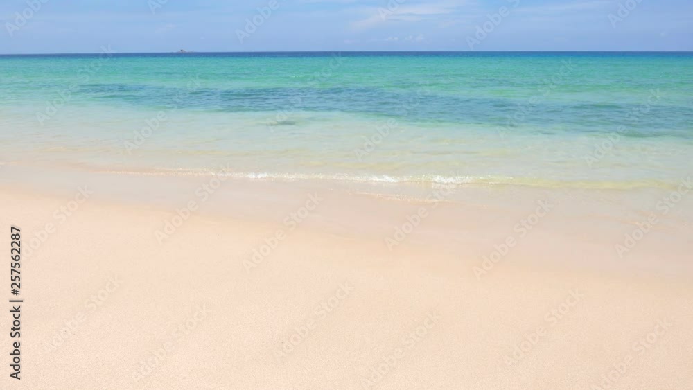 Tropical beach shoreline with golden sandy beach and clear blue water Tropical beach shoreline with golden sandy beach and clear blue water