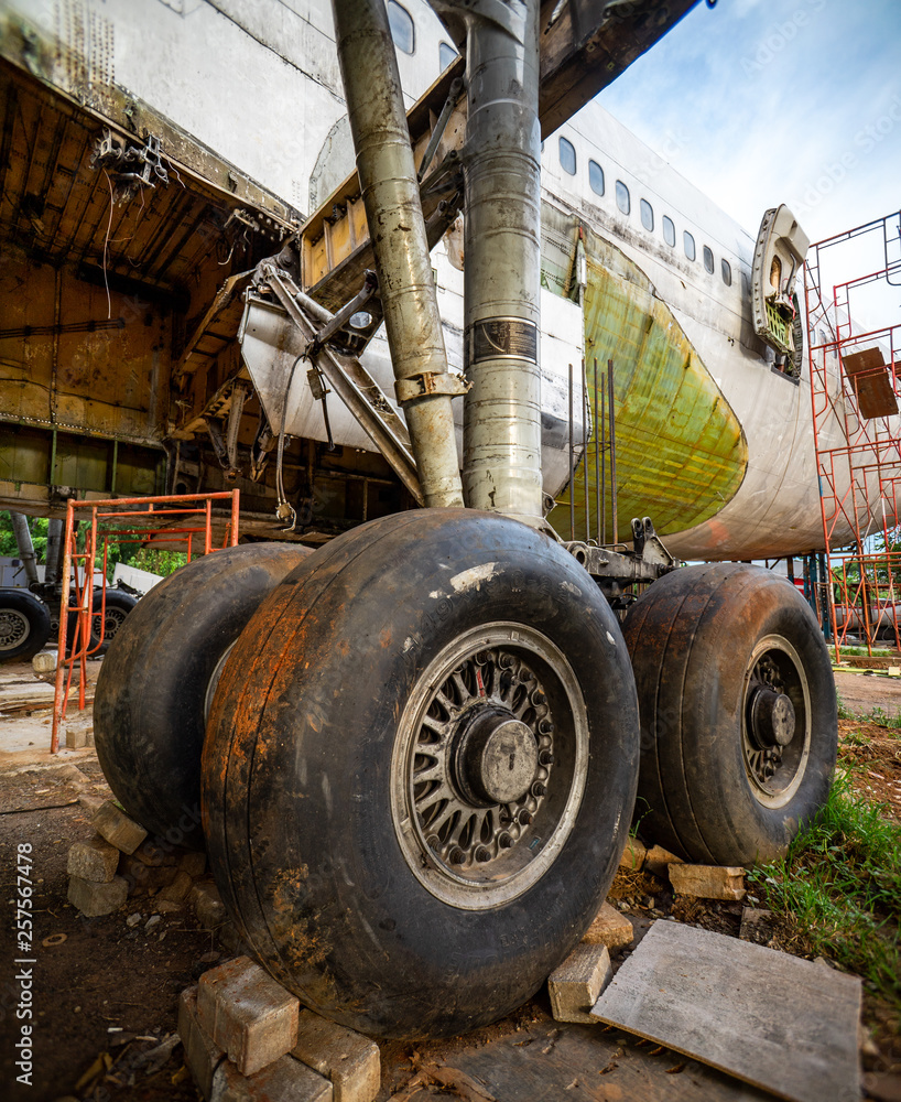 Landing Gear of Aircraft at Airplane Graveyard or Cemetery. Old Plane Being Recycling of Its Part at Storage Facility. Landing Gear of Aircraft at Airplane Graveyard or Cemetery. Old Plane Being Recycling of Its Part at Storage Facility.