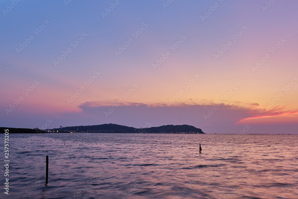 Beautiful sunset scenic of Ang Sila bay. The Ao Thai ocean in Chonburi province. The eastern of Thailand.