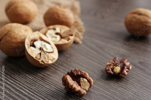 walnuts on dark wooden background selective focus perspective view