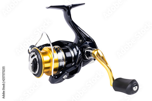 Fishing tackle. Fishing reel isolated on white background with clipping path. Modern fishing reel isolated. Empty space. Copy space. Mockup