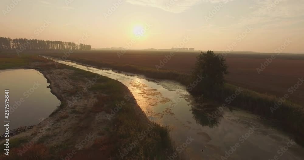 Aerial: The dykes and shoreline of the Oosterschelde, the Netherlands. Filmed during a hazy sunset. Aerial: The dykes and shoreline of the Oosterschelde, the Netherlands. Filmed during a hazy sunset.