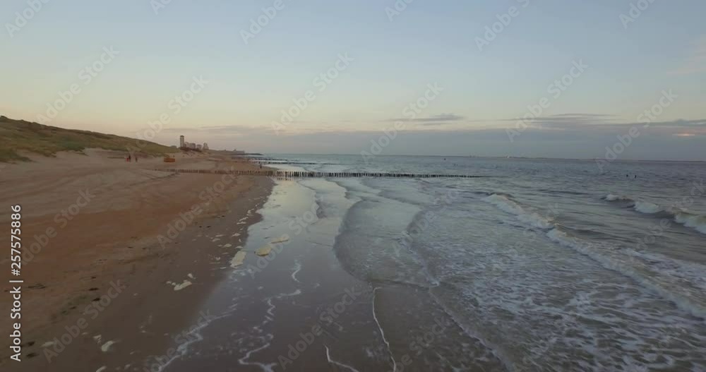 Aerial: The beach between Vlissingen and Dishoek during sunset. Aerial: The beach between Vlissingen and Dishoek during sunset.