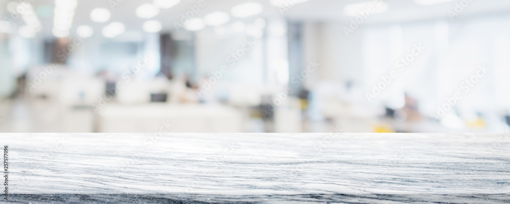 Empty white marble stone table top on blurred with bokeh co working office space interior banner background - can be used for display or montage your products Empty white marble stone table top on blurred with bokeh co working office space interior banner background - can be used for display or montage your products