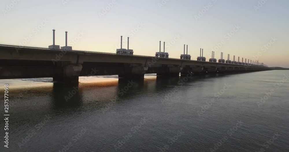 Aerial: The Oosterschelde storm surge barrier and windturbines in the Netherlands. Aerial: The Oosterschelde storm surge barrier and windturbines in the Netherlands.