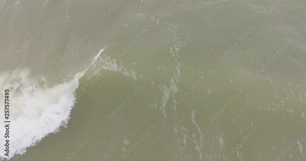 Aerial: An overcast day at the sand beach between Domburg and Westkapelle, the Netherlands. Aerial: An overcast day at the sand beach between Domburg and Westkapelle, the Netherlands.