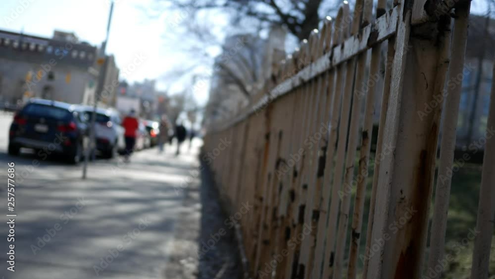 Rusty fence bordering sidewalk in Oakland Pennsylvania Rusty fence bordering sidewalk in Oakland Pennsylvania