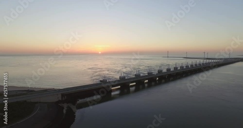 Aerial: The Oosterschelde storm surge barrier and windturbines in the Netherlands. photo