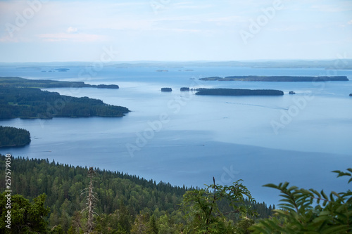 Summer landscape view over the lake Pielinen from the top of the UkkoKoli, a fell at the Koli national park, Joensuu, Finland, the land of a thousand lakes. © Teemu Tretjakov