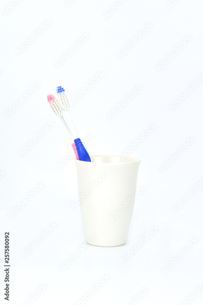 tooth brushes in glass tooth brushes in glass