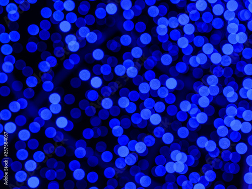 Blue bokeh is blurred, defocused. Christmas lights.