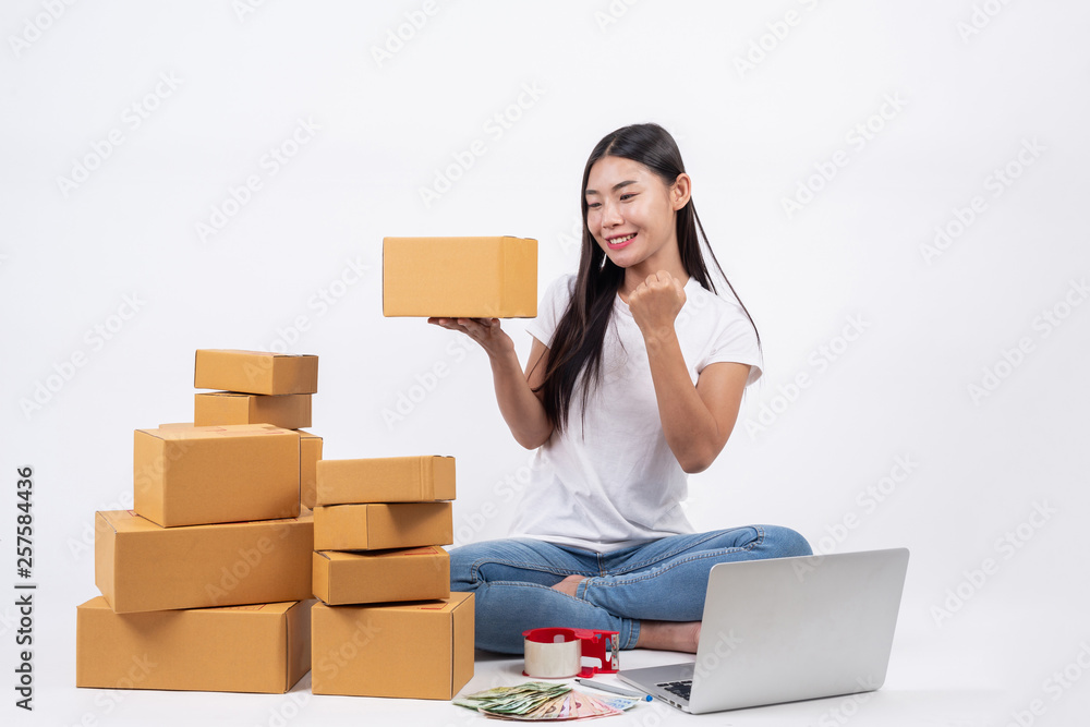 Happy women from ordering products from customers, business owners who work at home on a white background, Online shopping business operators Independent work concept.
