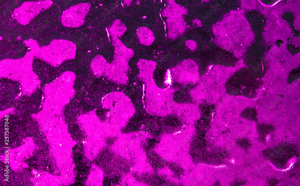 Ice on pink glass as abstract background Ice on pink glass as abstract background