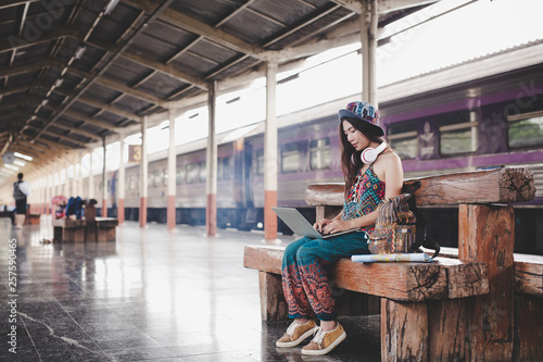 Women holding a map at the train station Tourism concept