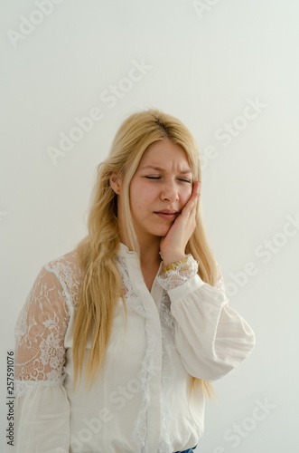 Young woman is having toothache.