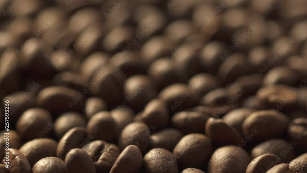 Coffee beans rotation in the slowed-down movement macro. Coffee beans rotation in the slowed-down movement macro.