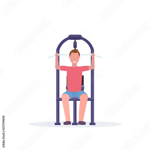 sporty man working out on lat pull down machine bodybuilder training in gym training apparatus healthy lifestyle concept flat white background