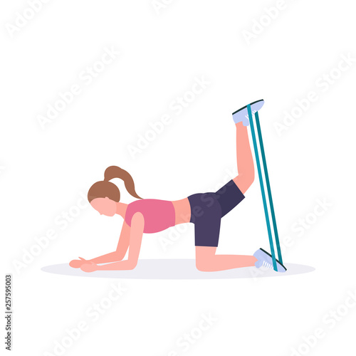 sporty woman doing exercises with resistance band girl training in gym stretching workout healthy lifestyle concept flat white background