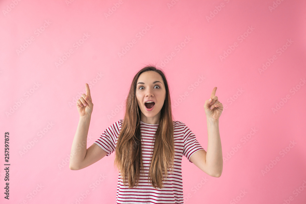 Young beautiful girl raised her finger up which means an idea or a eureka or a decision. Young beautiful girl raised her finger up which means an idea or a eureka or a decision.