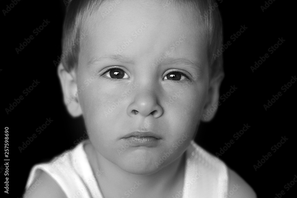 Dramatic portrait of kid looking at camera with angry face, Emotional photo of Displeased boy with unhappy face, Head shot of anger young caucasian boy, Spoiled child and Family violence concept Dramatic portrait of kid looking at camera with angry face, Emotional photo of Displeased boy with unhappy face, Head shot of anger young caucasian boy, Spoiled child and Family violence concept