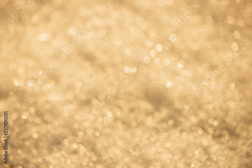 Golden silver texture of defocused lights. Bright spotted bokeh.