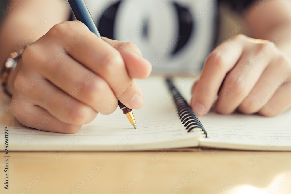 female hands with pen writing on notebook - Image female hands with pen writing on notebook - Image