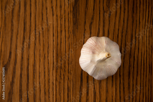 Garlic bulb on the wooden vintage background