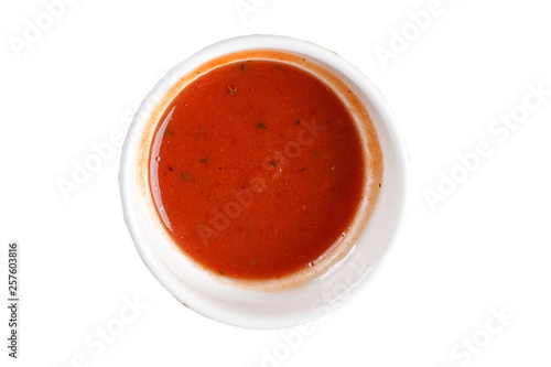 Chili sauce in a bowl on white background. One of the collection of various sauces.