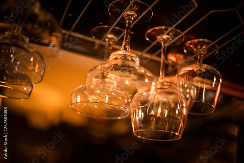 Hanging wine glasses in a pub