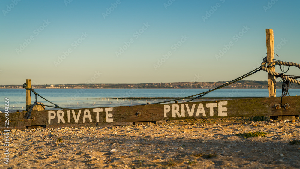 Fototapeta premium Sign: Private, seen at Shellness Beach on the Isle of Sheppey, Kent, England, UK