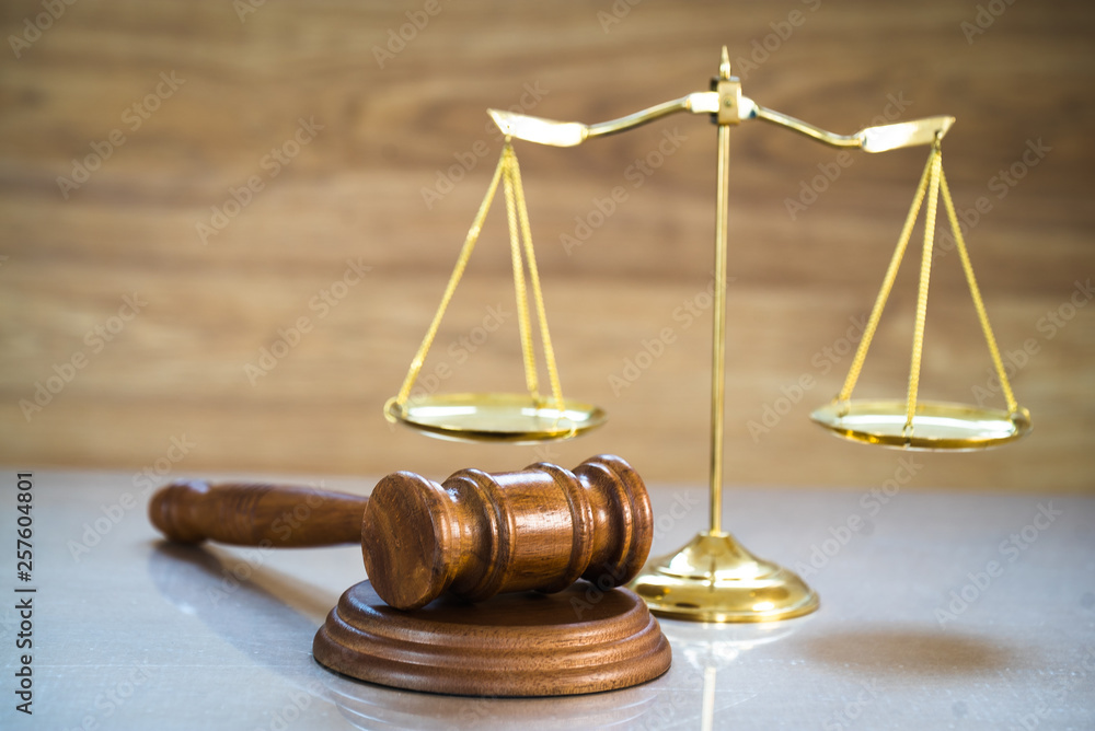 Law and Justice concept on wooden background