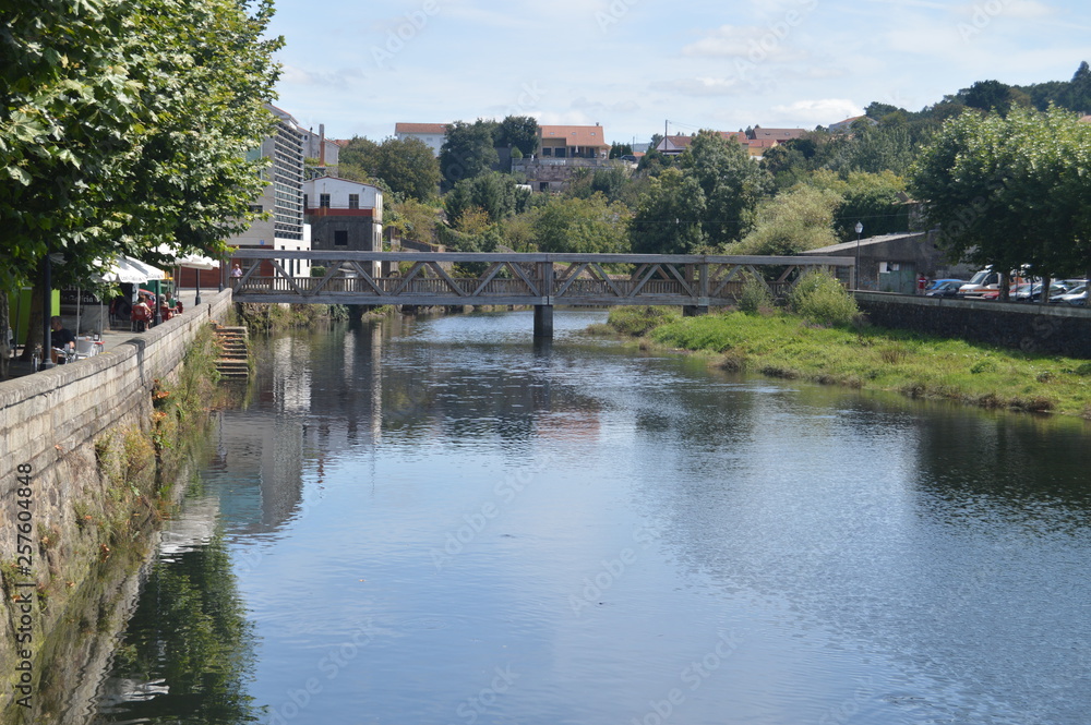 Wooden Bridge On The Traba River Before Flowing Into The Ria In Noya. Nature, Architecture, History, Street Photography. August 19, 2014. Noia, La Coruña, Galicia, Spain. Wooden Bridge On The Traba River Before Flowing Into The Ria In Noya. Nature, Architecture, History, Street Photography. August 19, 2014. Noia, La Coruña, Galicia, Spain.