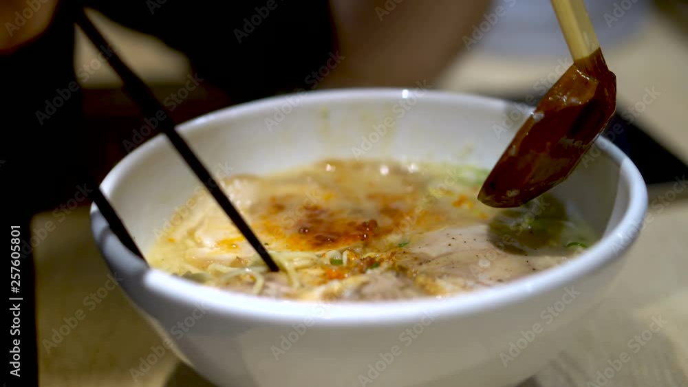 Stirring Authentic Japanese Ramen With Chopsticks Stirring Authentic Japanese Ramen With Chopsticks