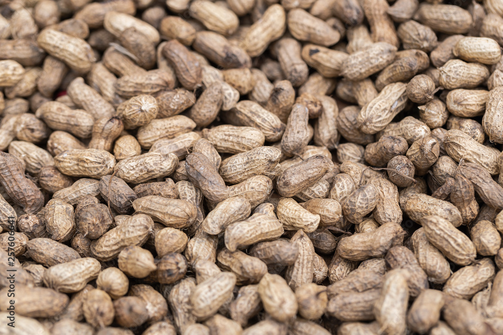 Pile of peanut in shell texture at market for food and agriculture concept design. Pile of peanut in shell texture at market for food and agriculture concept design.