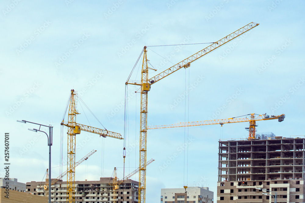construction cranes build houses construction cranes build houses