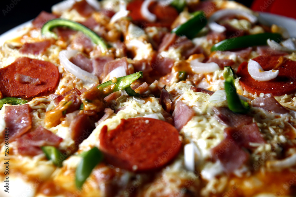 Ham, pepperoni, cheese with green bell pepper pizza Ham, pepperoni, cheese with green bell pepper pizza