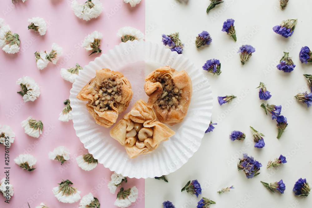 Obraz premium Baklava sweet dessert. Pastry made of layers of filo filled with chopped nuts and sweetened and held together with syrup or honey