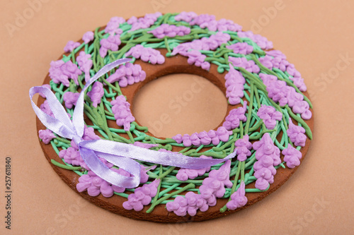 gingerbread in the shape of a round floral wreath, lilac flowers, holiday
