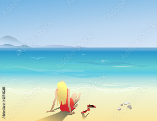 The girl in the sand sits on the beach. Vacations in the tropics © Elena