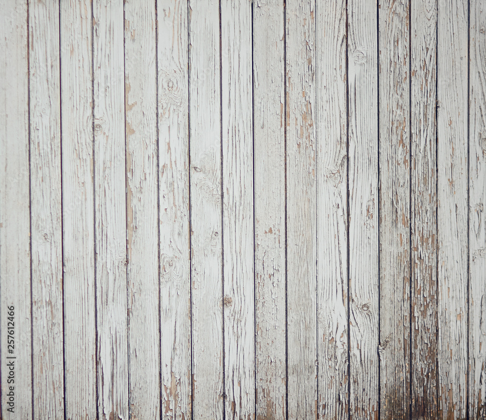 Fototapeta premium Abstract background of old painted white boards. From time, old age and dampness paint crumbles.