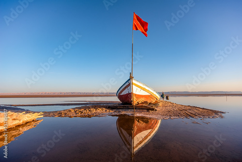 Photos abandoned boat on the bottom of dry salty lake