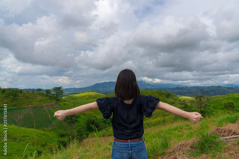 Happy young cute Asian Japanese girl hipster backpack women travelling looking at beautiful sky mountains scenery views Happy young cute Asian Japanese girl hipster backpack women travelling looking at beautiful sky mountains scenery views
