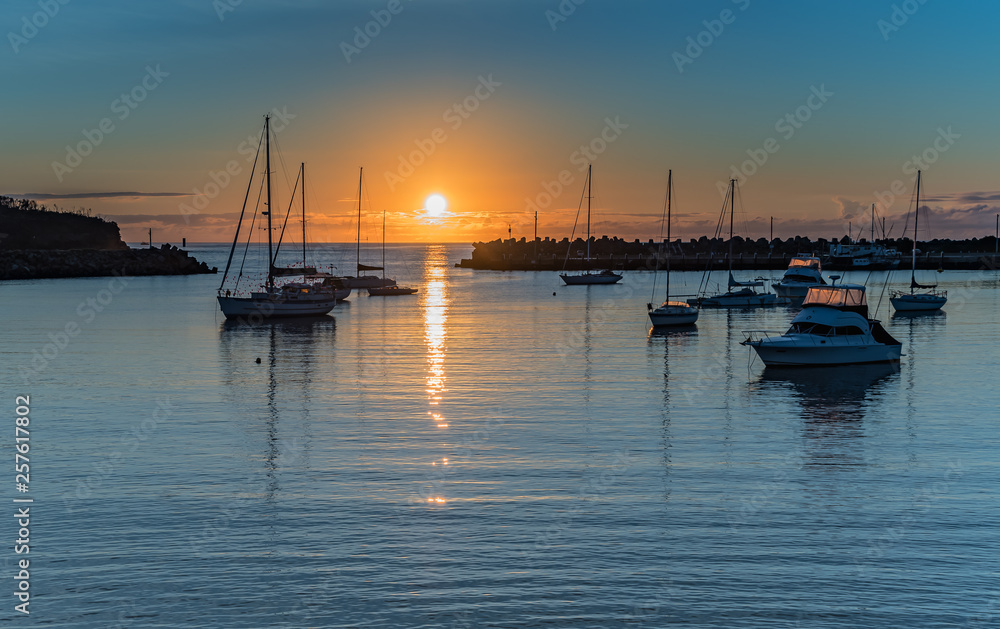 Fototapeta premium Sunrise and boats in the harbour