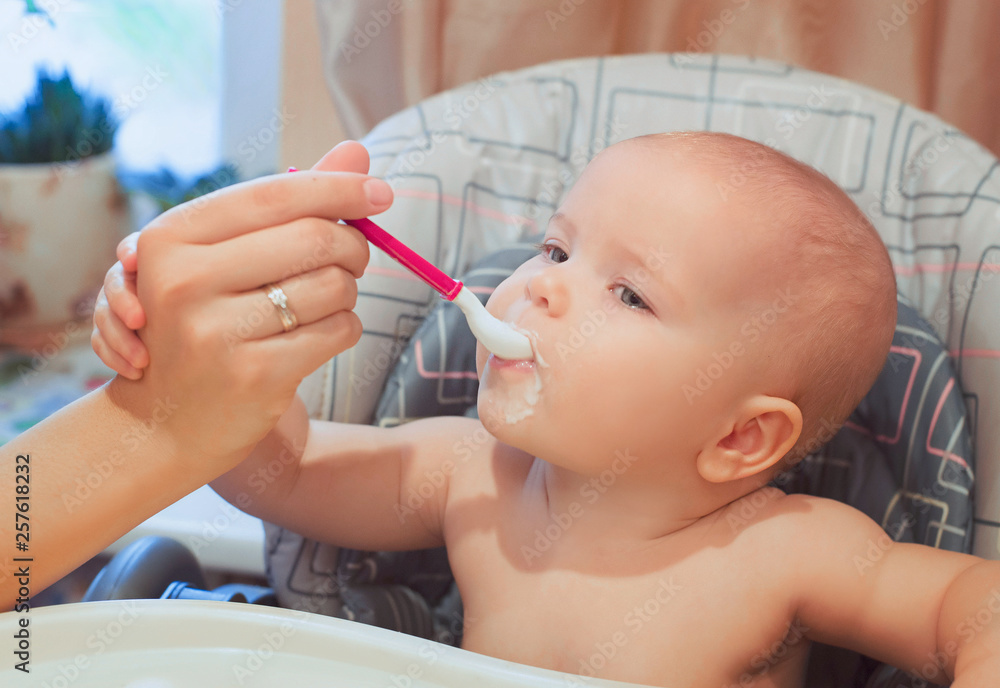 Little baby infant is eating its food. baby food, formula, baby care Little baby infant is eating its food. baby food, formula, baby care