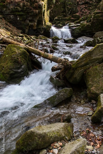 mountain waterfall among big stones