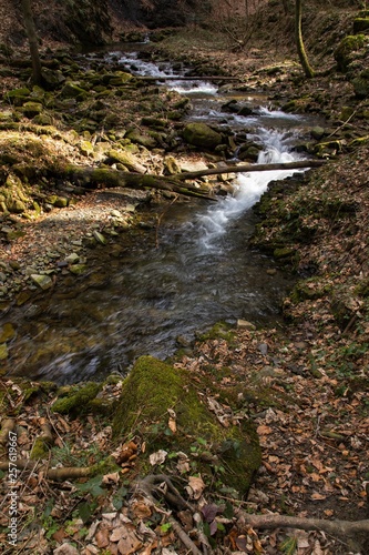 mountain waterfall among big stones