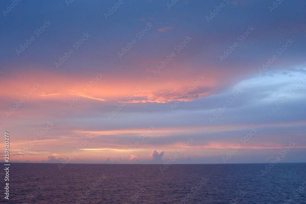 The landscape from the deck of the ocean liner is incredible beauty of the bright natural scenery of the sunset on the sea horizon.