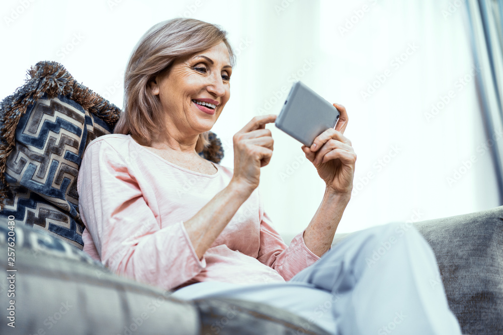 Beautiful middle aged woman in casual clothes is making selfie Beautiful middle aged woman in casual clothes is making selfie