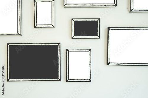empty frame on white wall  .Blank space for text and images.