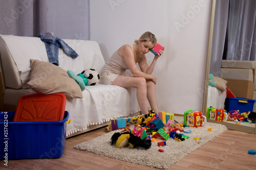 clutter in the nursery. mom is tired of looking at toys. the mess in the house